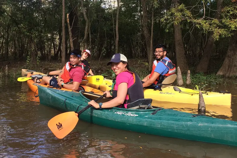 Friends in kayaks on a quiet river